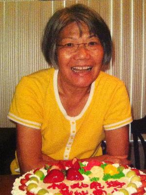 My mom, Peggie, celebrating her birthday in summer 2011, several months after her official ALS diagnosis. With bulbar ALS, her speech and swallow functions were already impaired by the disease and she already had a feeding tube to supplement proper nutrition.