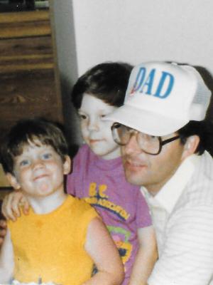 Between my goofy smile and Dad's hat, we were not ... a subtle family.